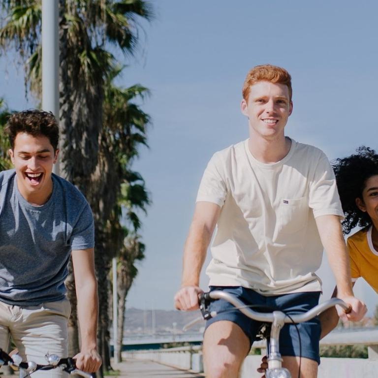 Young adults riding bikes 